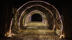 a bridge with a tunnel with lights on it at Amaranthus Hotel in Doradal