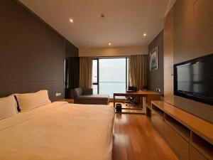 TV a/nebo společenská místnost v ubytování Guangzhou City Inn Hotel Apartment Pazhou