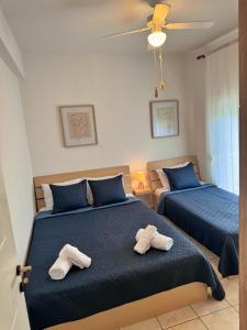 Postel nebo postele na pokoji v ubytování Villa VaLenia