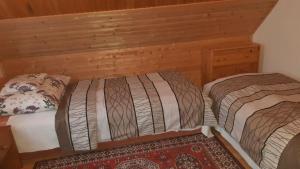 A bed or beds in a room at Klimatisiertes Ferienhaus in Bükfürd mit Botanischem Garten