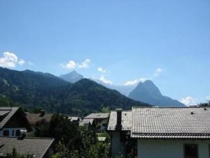 a view of a town with mountains in the background at Ferienwohnung in Garmisch-Partenkirchen - b48490 in Garmisch-Partenkirchen