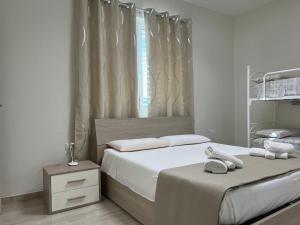 Postel nebo postele na pokoji v ubytování Salento Appartamento Sole