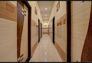 a hallway of a gymnasium with wooden walls and doors at AK VILAS - BEST BUDGETED HOTEL IN JAIPUR in Jaipur
