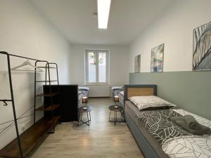 Кровать или кровати в номере Rudi Homes Essen #1