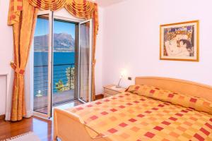 Ένα ή περισσότερα κρεβάτια σε δωμάτιο στο Panoramic Villa Clementina
