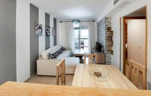a dining room and living room with a table at Gorgeous Apartment In Rota With Wifi in Rota