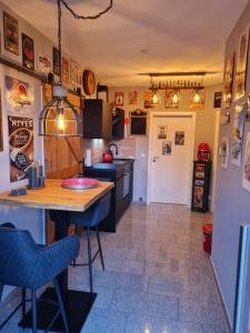 a kitchen with a wooden table and chairs at Premium Apartment in Sehnde