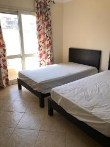 Un pat sau paturi într-o cameră la La Vista 1, Ain Soukhna Family Chalets