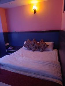 Voodi või voodid majutusasutuse Express Myagdi Hotel Pvt Ltd toas