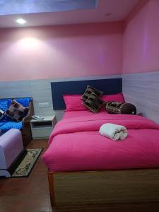 Voodi või voodid majutusasutuse Express Myagdi Hotel Pvt Ltd toas