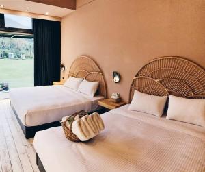 Postel nebo postele na pokoji v ubytování Taitung Tianqing Youth B&B