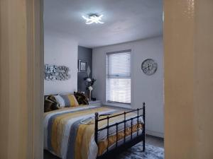 Łóżko lub łóżka w pokoju w obiekcie Pass the Keys New Dream Home Estate