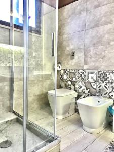 a bathroom with a shower and a toilet and a sink at Marsala al centro n 9 in Marsala