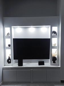 A television and/or entertainment centre at Paradise Apartment, Lardos Village