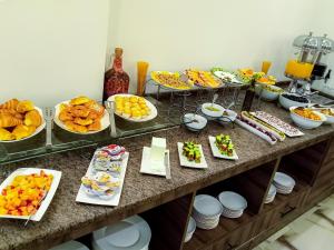 a buffet with many different types of food on it at Petra Premium Hotel in Wadi Musa