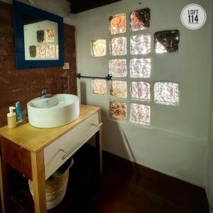 a bathroom with a sink and some glass windows at LOFT-114 in Santa Cruz de Tenerife