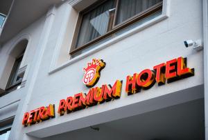 a sign for a restaurant on the side of a building at Petra Premium Hotel in Wadi Musa