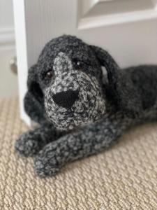 a stuffed teddy bear laying on the floor at Epic Location, Views & Large Private Terrace in Windsor