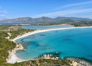 an aerial view of a beach with turquoise water at Casa Giada in Villasimius