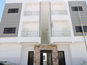 a view of the front of a building at Résidence Les Oliviers by Jad Inn in Nouakchott
