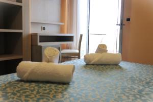 Postel nebo postele na pokoji v ubytování Hotel Costa Verde