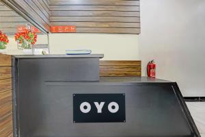 a oo sign on a counter in a room at OYO Hotel Blue Inn Residence Near R City Mall in Mumbai