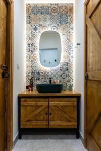 a bathroom with a sink and a mirror at SKG City Cabin in Thessaloniki