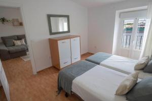 Tempat tidur dalam kamar di GINVA - Apartamento en pleno centro 2