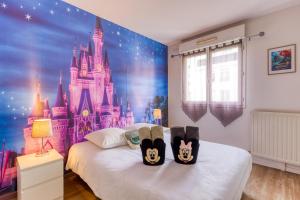 Posteľ alebo postele v izbe v ubytovaní Cosy home / Disney / jungle