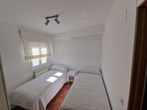 Ένα ή περισσότερα κρεβάτια σε δωμάτιο στο Casa Las Tejeras