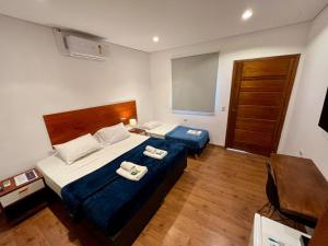Voodi või voodid majutusasutuse Bistu Hotel - Vila Nova Conceição toas