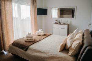 a bedroom with a bed with two towels on it at Villa Isabella in Opatija