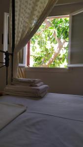 A bed or beds in a room at Almond trees house