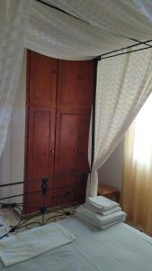 A bed or beds in a room at Almond trees house