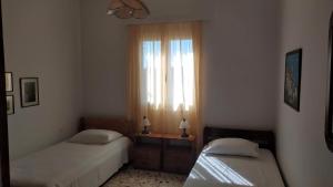A bed or beds in a room at Almond trees house