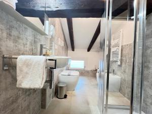 a bathroom with a white toilet and a sink at Hotel Vivit ***S in Mestre +181 photos