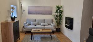a living room with a couch and a coffee table at Casa Rural Anais in San Nicolás