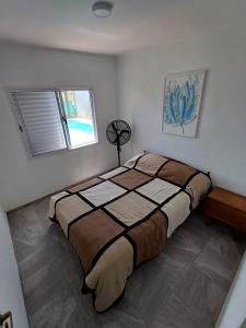 เตียงในห้องที่ Casa Quinta Las Palmeras