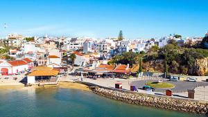 a view of a city with a river and buildings at Alvor Apartments - Center and Beach in Alvor