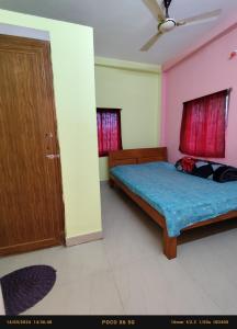 Posteľ alebo postele v izbe v ubytovaní India Tours Only Sundarban Natural Homestay