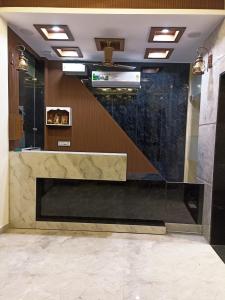 a lobby with a marble counter in a building at Hotel G-2 in Jalandhar