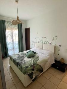 a bedroom with a bed and a window at La Corte del Principe in Bracciano