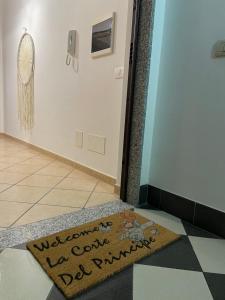 a welcome mat on the floor of a hallway at La Corte del Principe in Bracciano