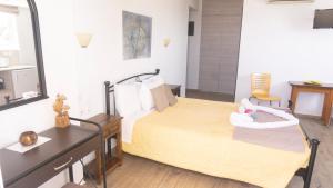 A bed or beds in a room at Seaside Studios Kirania