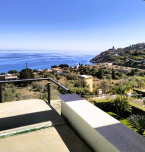 a view of the ocean from the balcony of a house at TorreNormanna Prestige House near Cefalù in Mandra Capreria