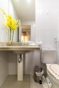 a bathroom with a sink and a toilet at Consolação Estúdio 127 in Sao Paulo