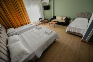 Letto o letti in una camera di Hotel Blini