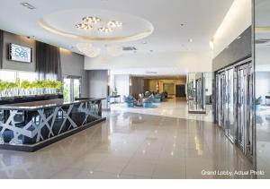 a lobby of a hotel with couches and a lobby at SEA Residences in Pasay near Mall of Asia 2BR and 1BR in Manila