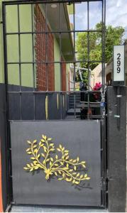 a door with a painting of a plant on it at Junzi in Ceiba