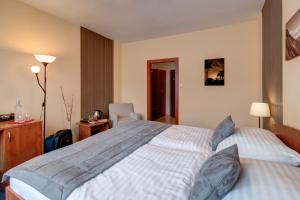 Posteľ alebo postele v izbe v ubytovaní LC - Hotel Ostrava
